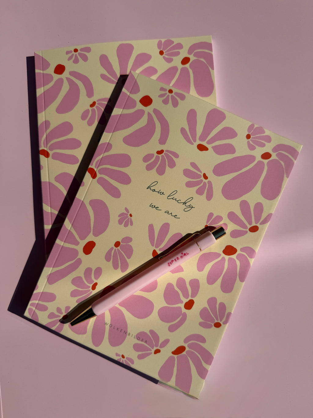 Notizbuch “HOWLUCKY”
